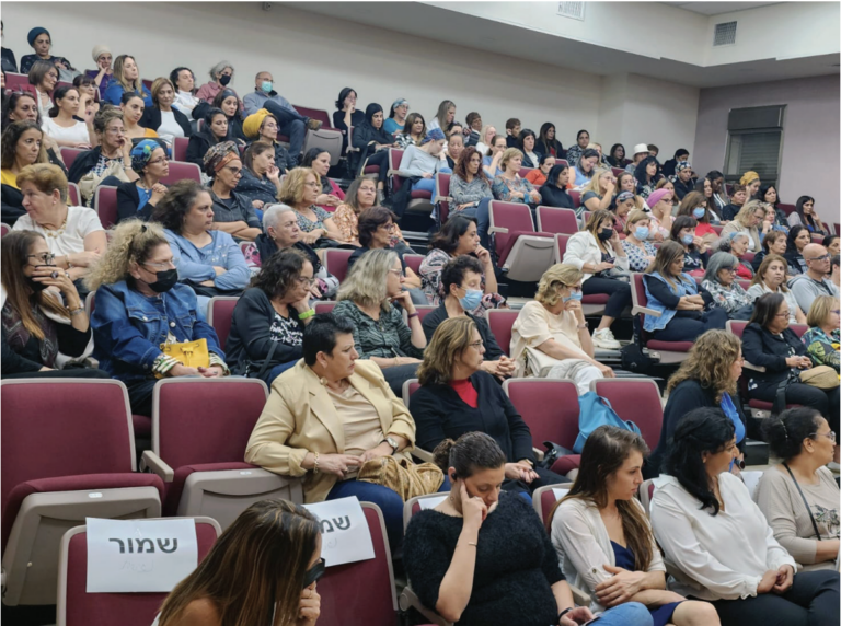 Audience members listen attentively at a NA’AMAT-sponsored conference.