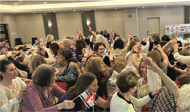 Centennial attendees celebrate by dancing with the Nirkoda Israeli Dancers.